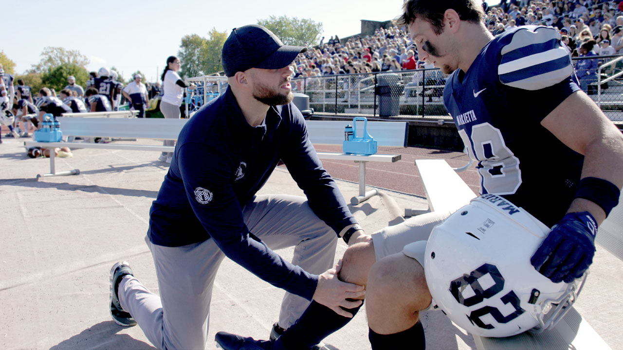 doctor with player on field